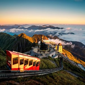 Scenic view of Sapa Vietnam with terraced rice fields, lush green mountains, and traditional ethnic minority villages in the northern highlands, a top travel destination in Southeast Asia for trekking and cultural tours.